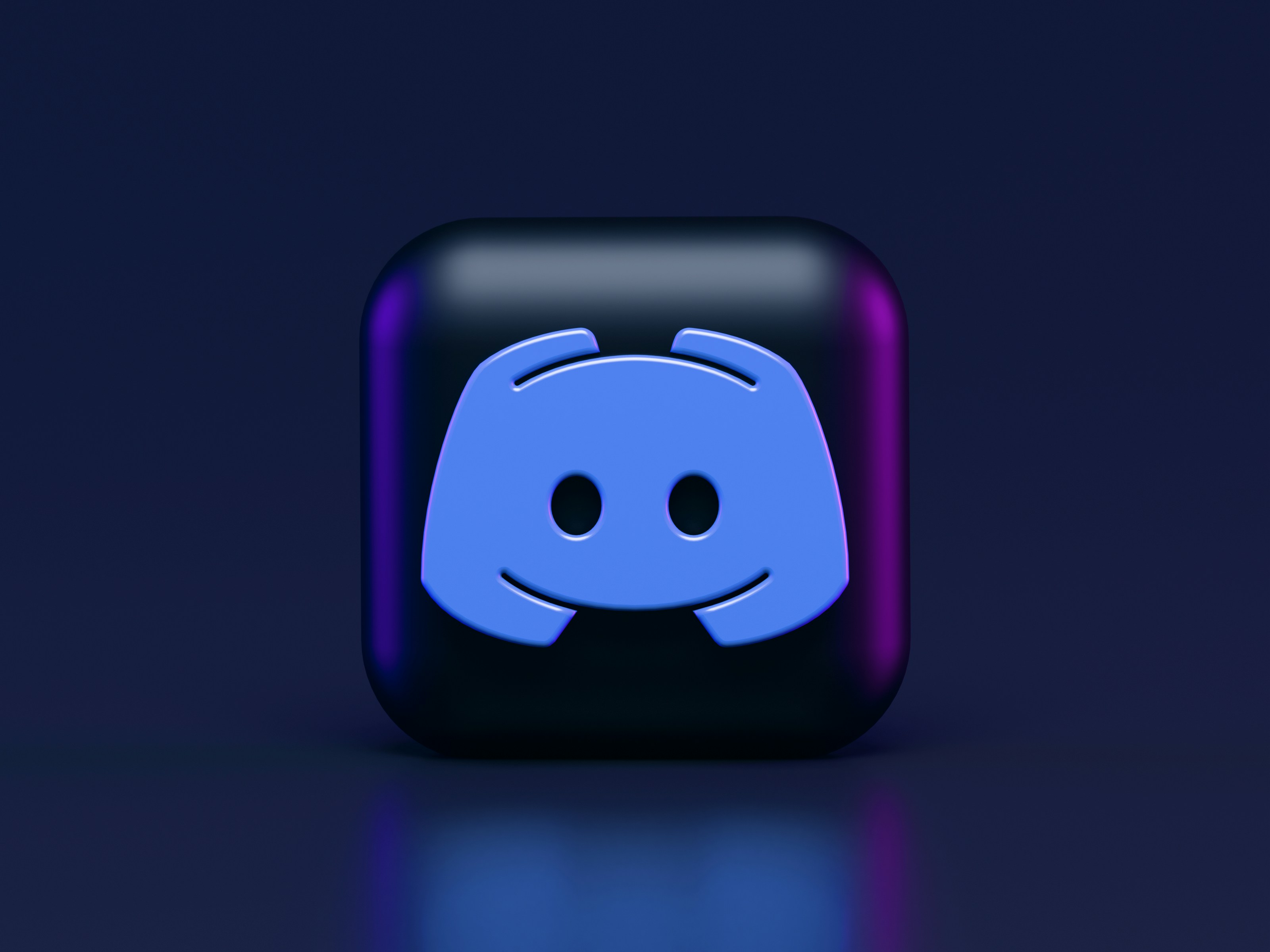 3D icon of Discord app on a sleek dark background, symbolizing the first step on how to build a simple Discord bot.