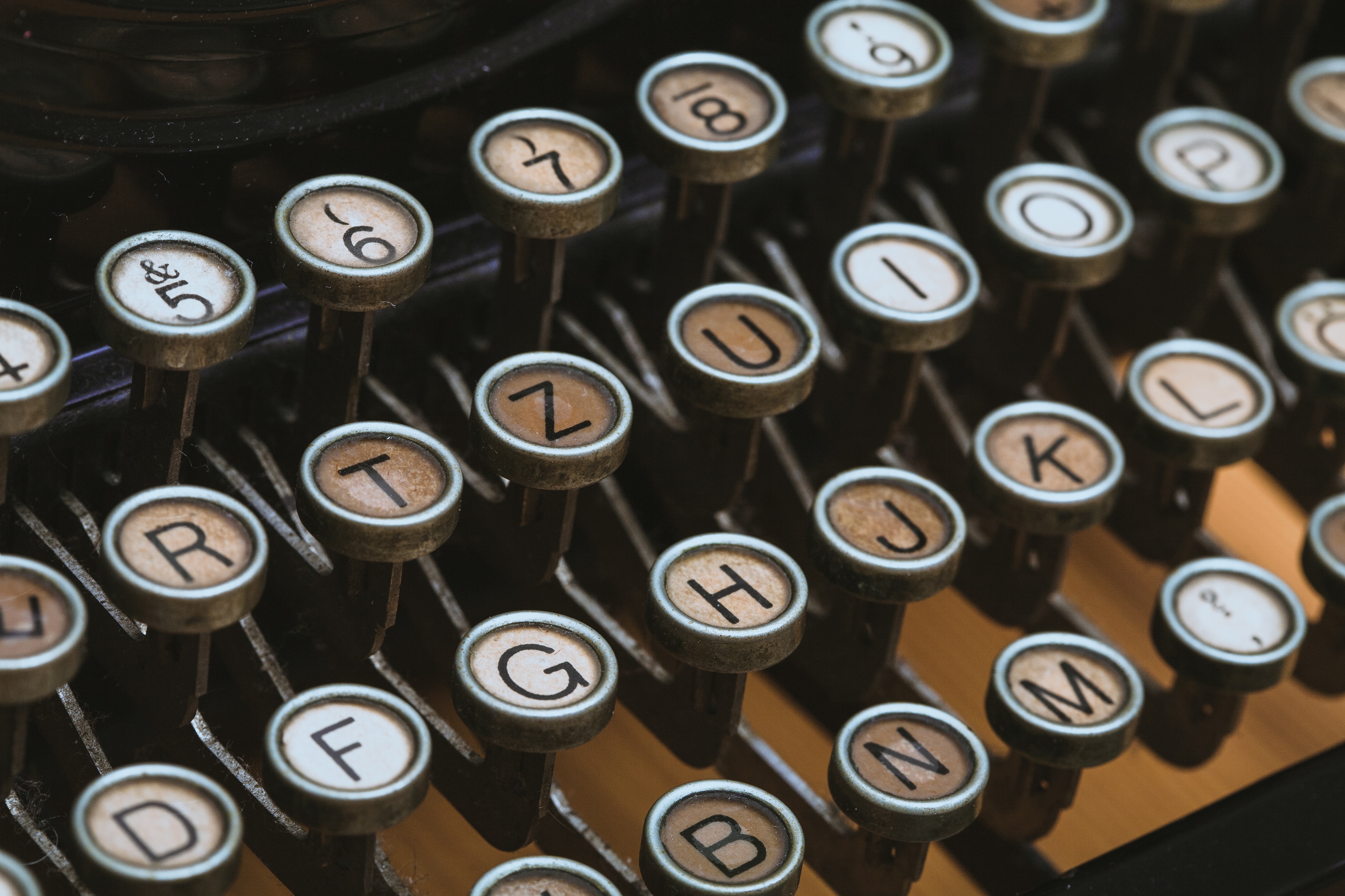Close-up of vintage typewriter keys, symbolizing the importance of precision in coding, analogous to 'How to improve Python code with type hinting' for better software development.
