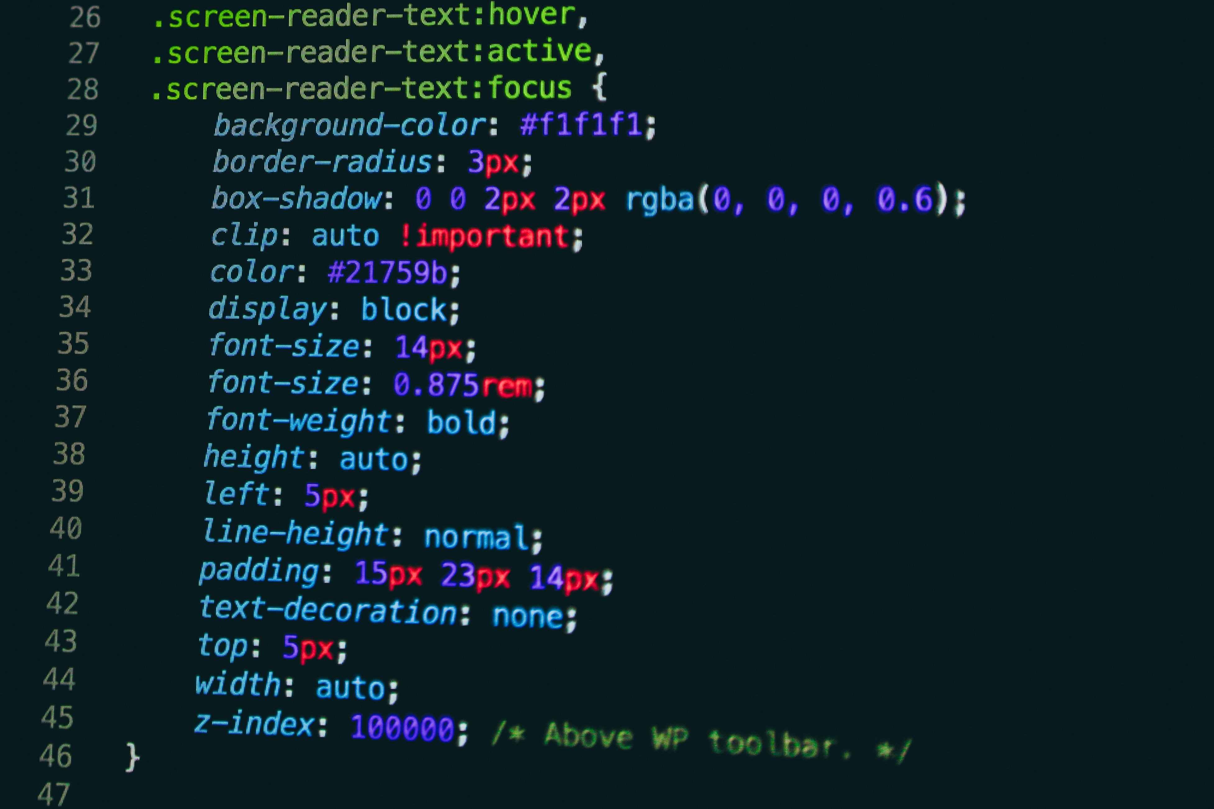Code editor displaying CSS with syntax highlighting, emphasizing the .screen-reader class. This image reflects the backend customization often seen in web development, similar to rendering templates with Jinja2 in Flask.